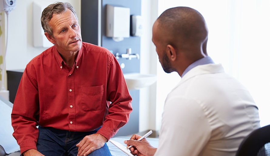 man speaking to doctor about gallbladder symptoms