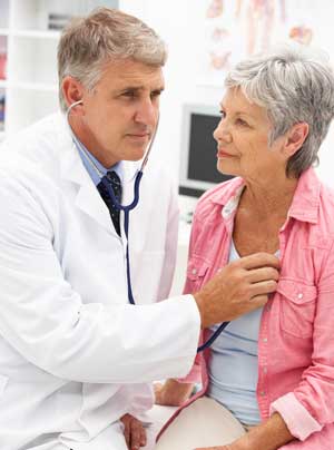 Doctor with patient with lung cancer recurrence