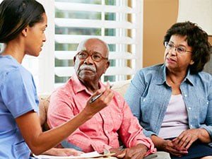 nurse discussing colorectal cancer with couple