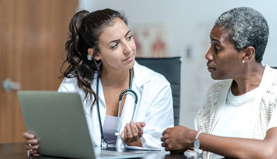 A doctor talks to a patient about lumpectomy