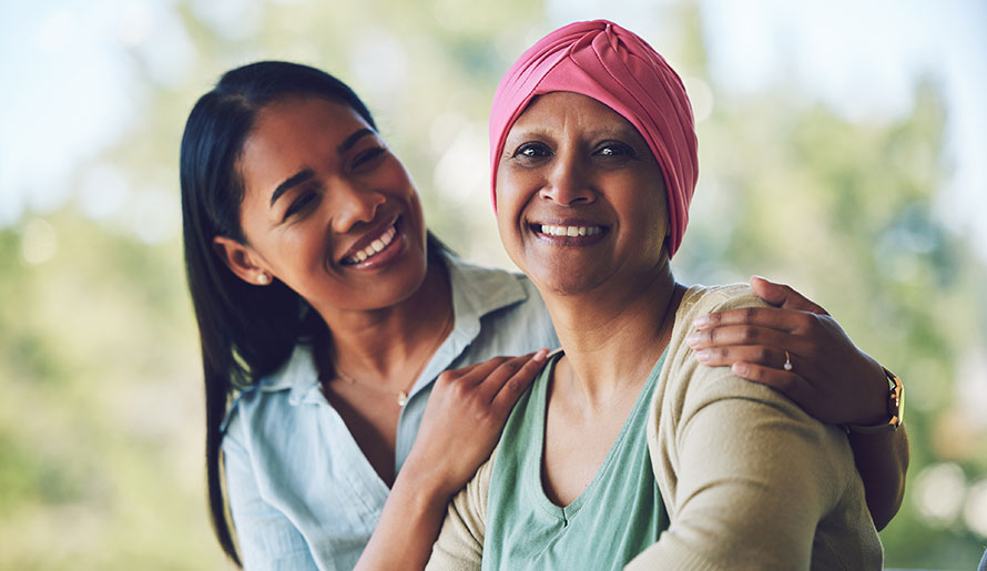 Mom wearing scarf on head with daughter 