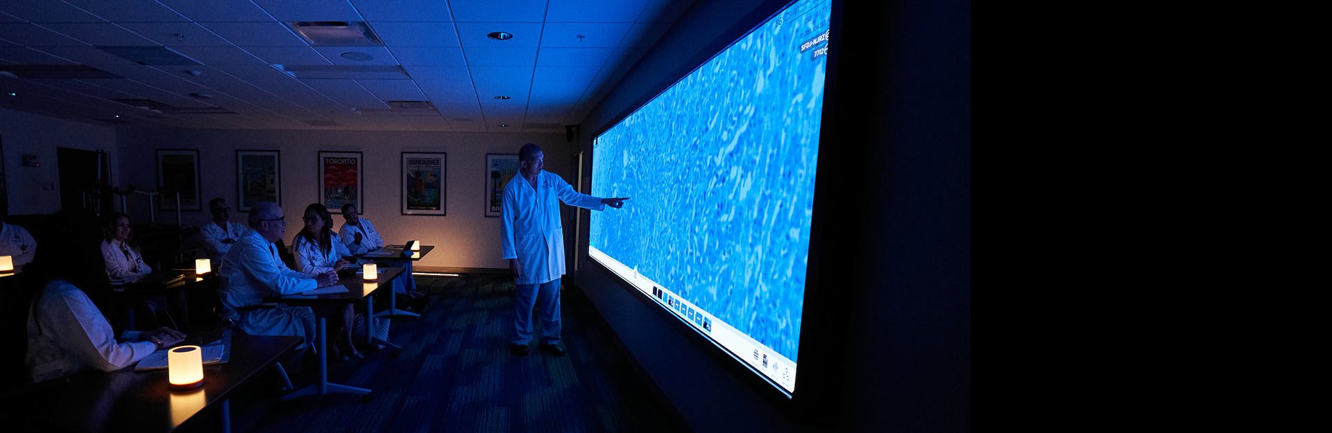 doctors reviewing a slide of a tumor