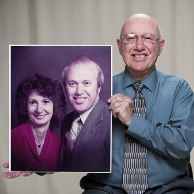 Photo of Ken, tongue cancer survivor, holding an image of himself and his wife.