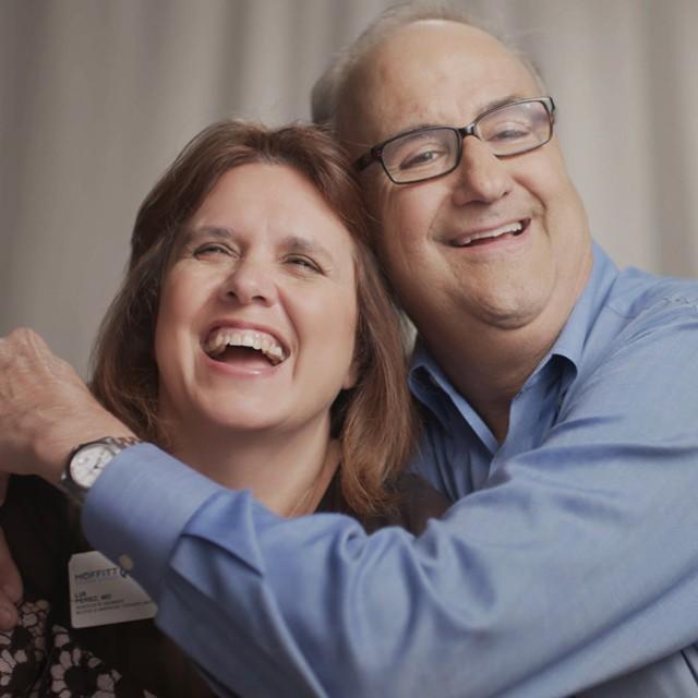 Nick, Stem Cell Transplant Survivor, smiling with his wife