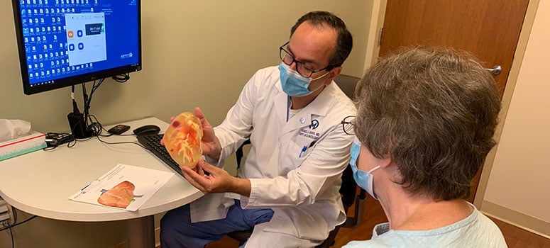 Dr. Daniel Anaya demonstrates how he plans to remove Jean Lowe's four tumors using a 3D model of her liver.