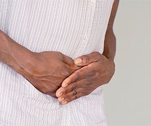 Man experiencing stomach bloating