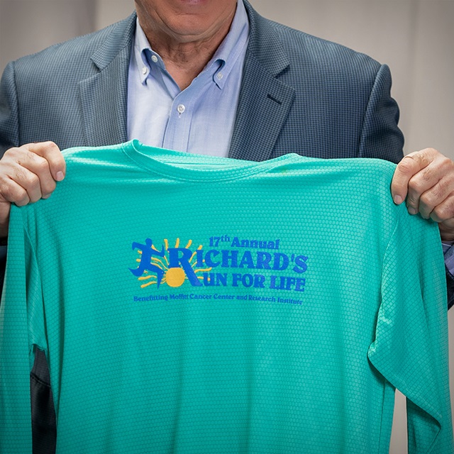 Richard holds a Richard's Run for Life t-shirt
