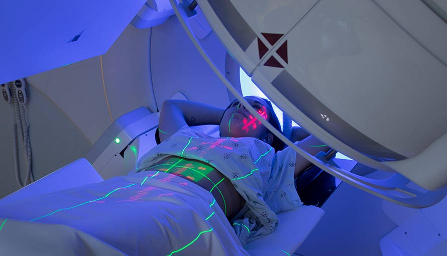 a woman receiving radiation therapy