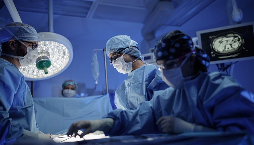 Reconstructive plastic surgeon in operating room
