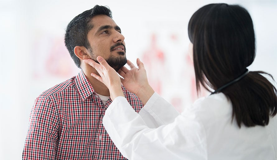 Doctor checking patient's lymph nodes