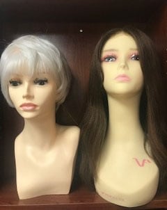 wig examples, one a light pixie stye, the other dark and long