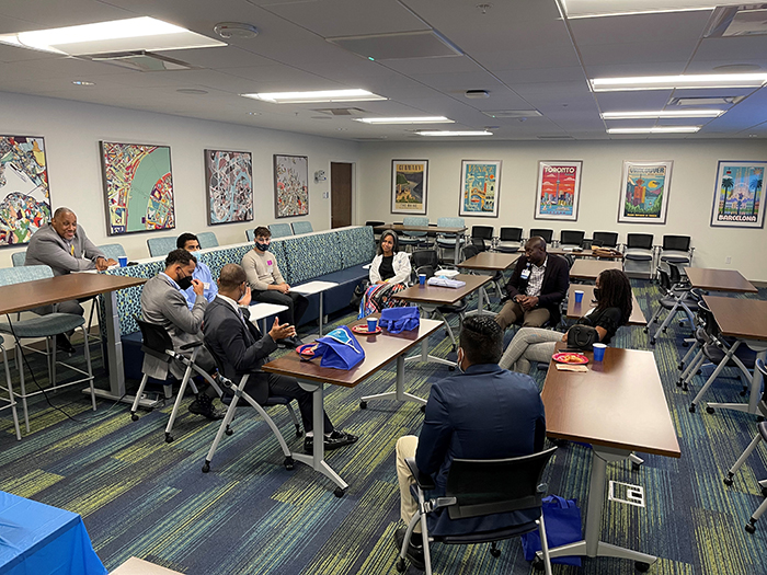 Members of the Brain Expansions Scholastic Training program and Moffitt's Faculty Diversity in Oncology Program  discuss strategies for success in medical school during a recent gathering on the Moffitt campus.
