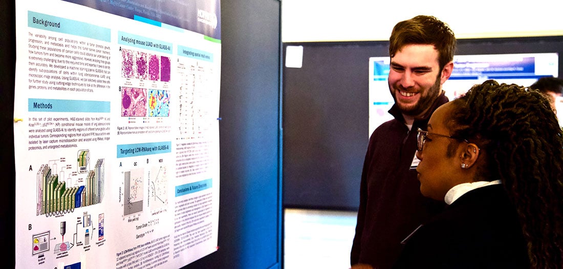 Postdocs sharing research posters