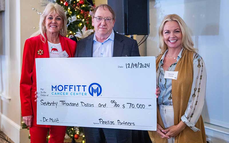 Pinellas Partners present a large check