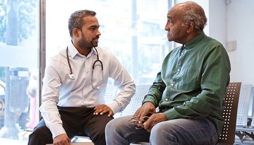 Doctor talking to senior patient