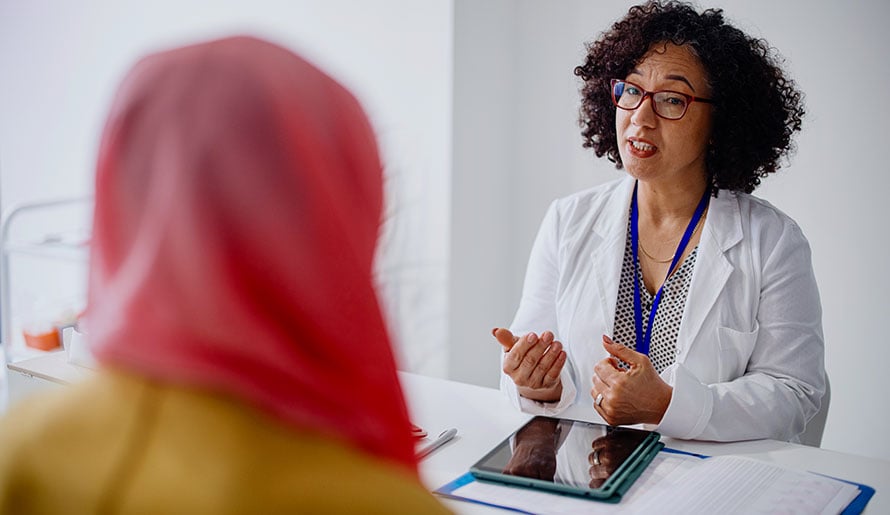 Female doctor speaking with patient
