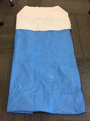Surgical wrap sewn into a sleeping bag lying flat on the floor
