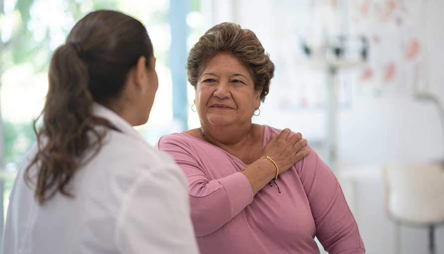 Woman speaking with lung cancer doctor