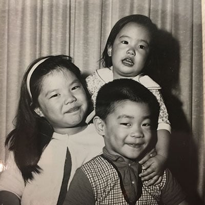 Dr. Patrick Hwu poses with two of his three sisters.