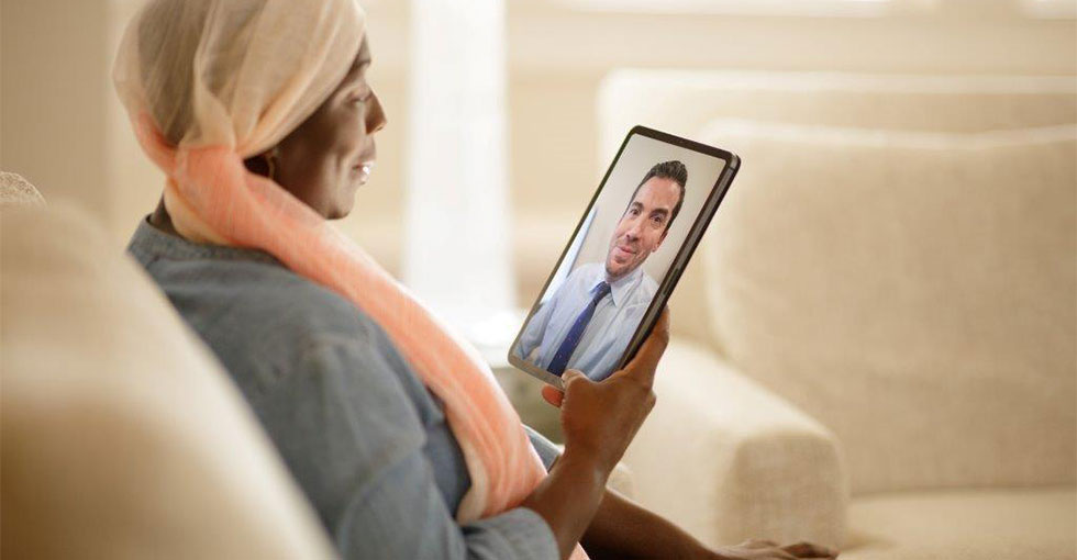 Woman With Cancer having a Virtual Visit with Doctor