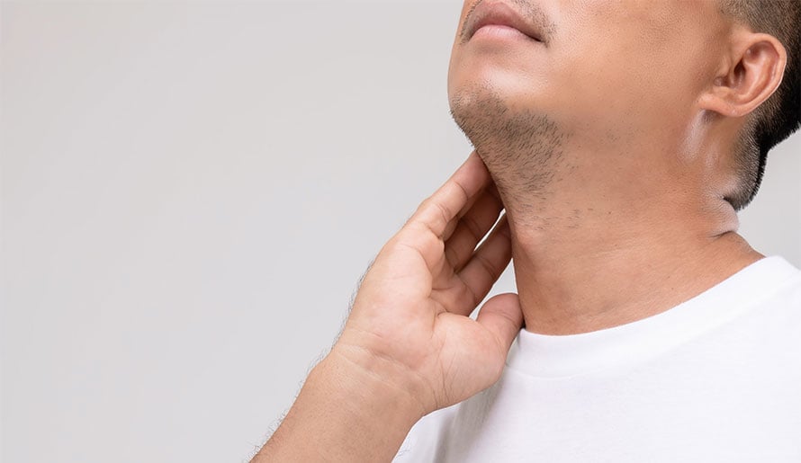 Man touching his neck by lymph nodes