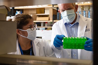Image of Dr. Bob Gillies in lab with colleague