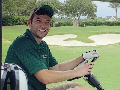 Photo of Danny New driving a golf cart