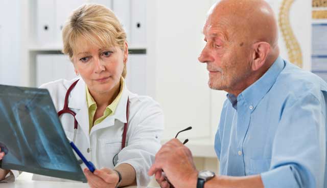 Doctor speaking with patient about mesothelioma prognosis