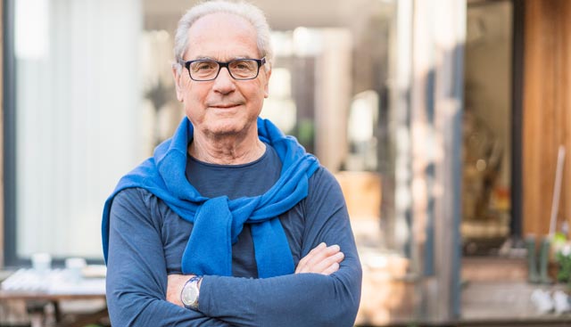 Man with Thymoma wearing a blue sweater