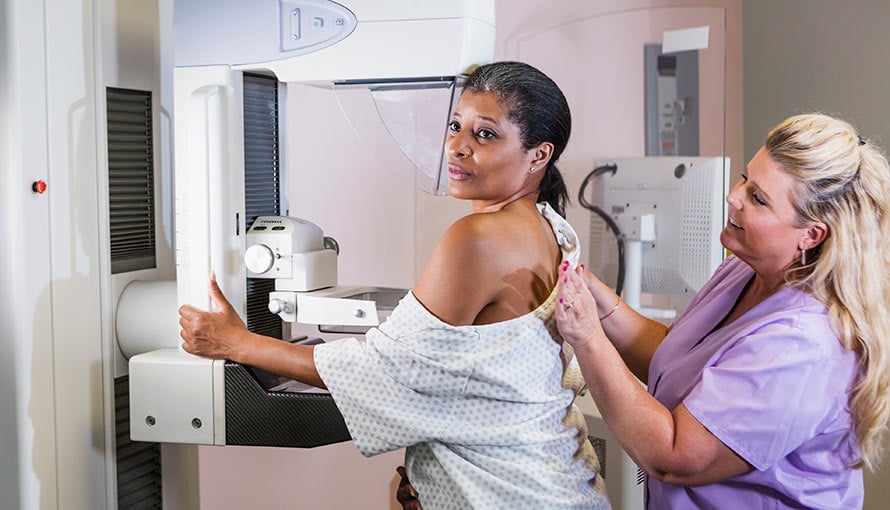 A woman getting a breast screening