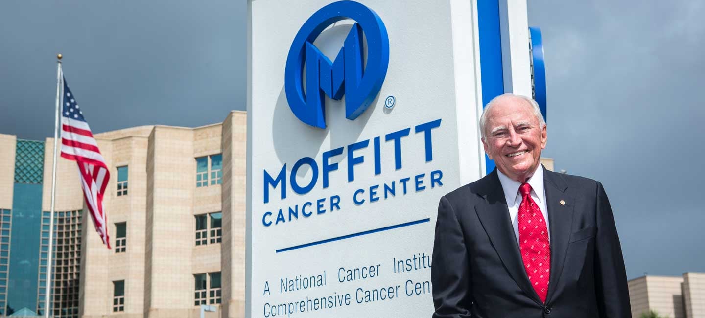 H. Lee Moffitt standing infront of his namesake hospital 