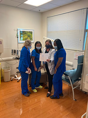 Magen Davis visits with nurses