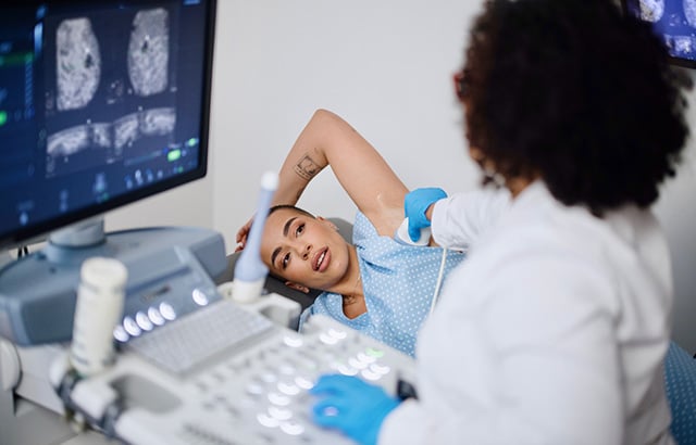 Patient receiving a breast scan