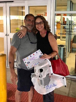 Lisa Assetta and her husband celebrate