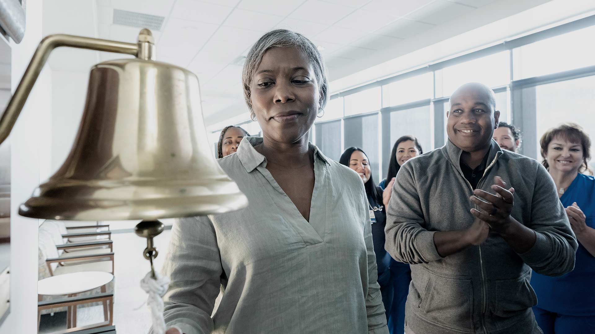 A patient rings a bell after finishing chemotherapy