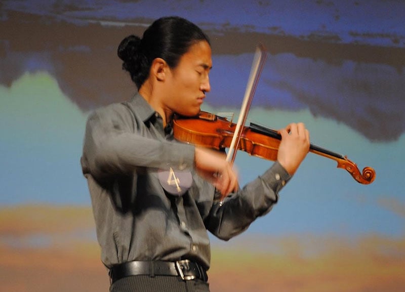 Dr. Samson Lu playing the violin