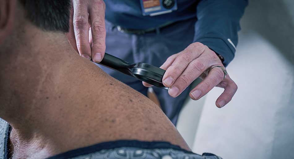 Doctor checking patient's skin