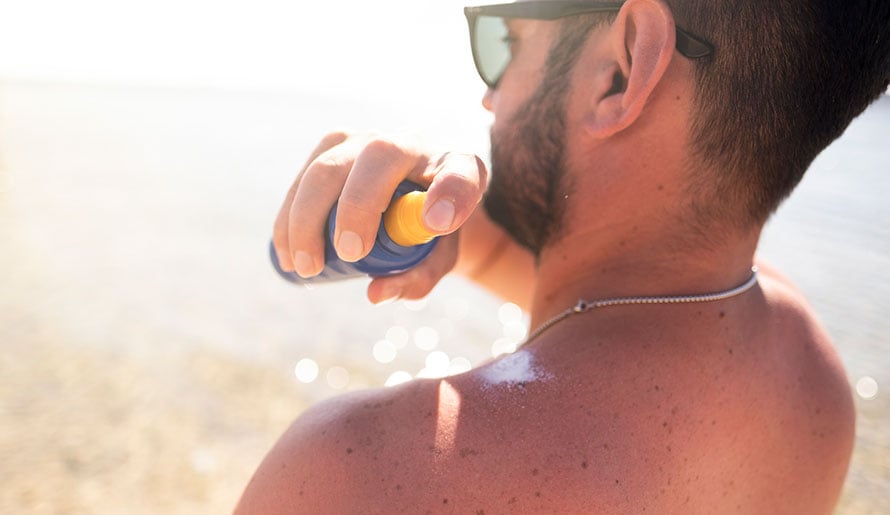 man getting a sunburn at the beach