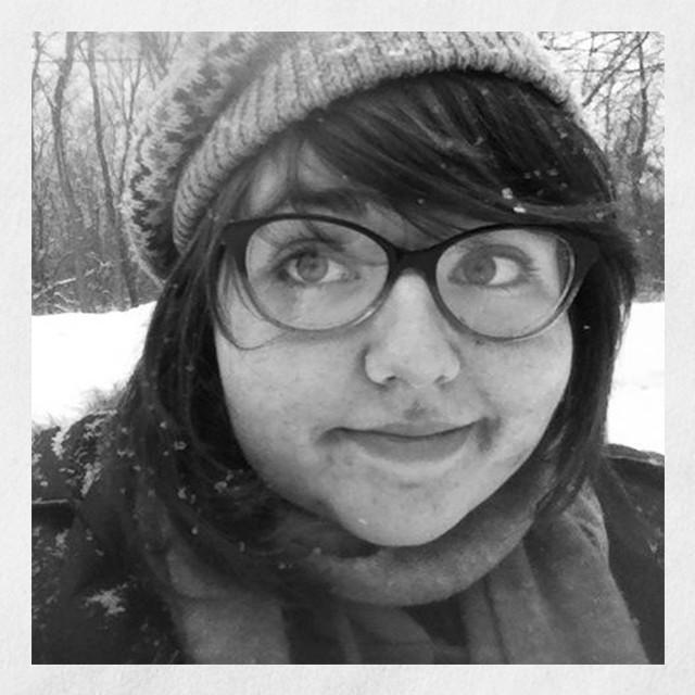 Headshot of Jackie, mesothelioma cancer patient, wearing glasses and a warm hat in the snow.