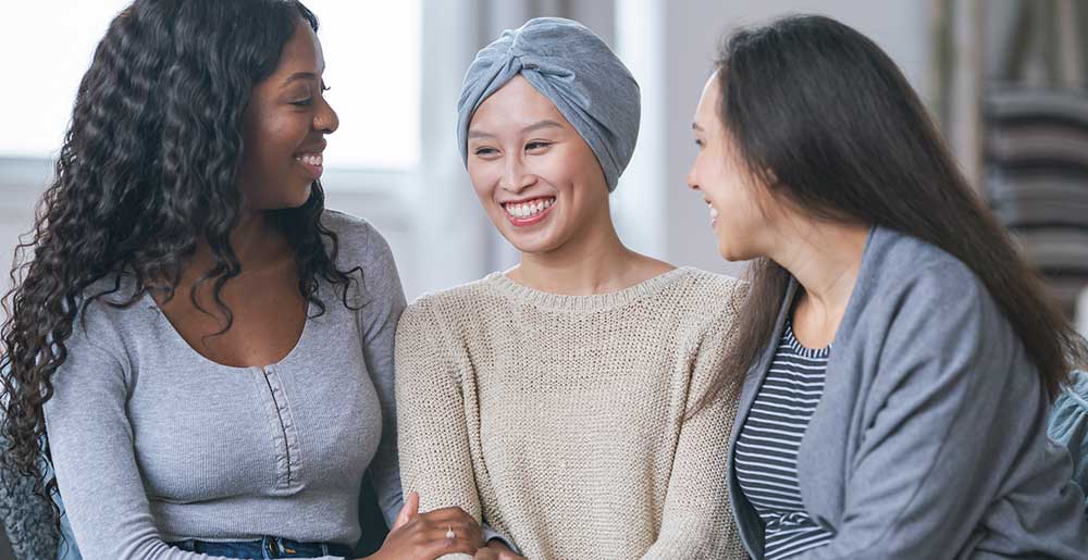 Friends supporting woman with cancer
